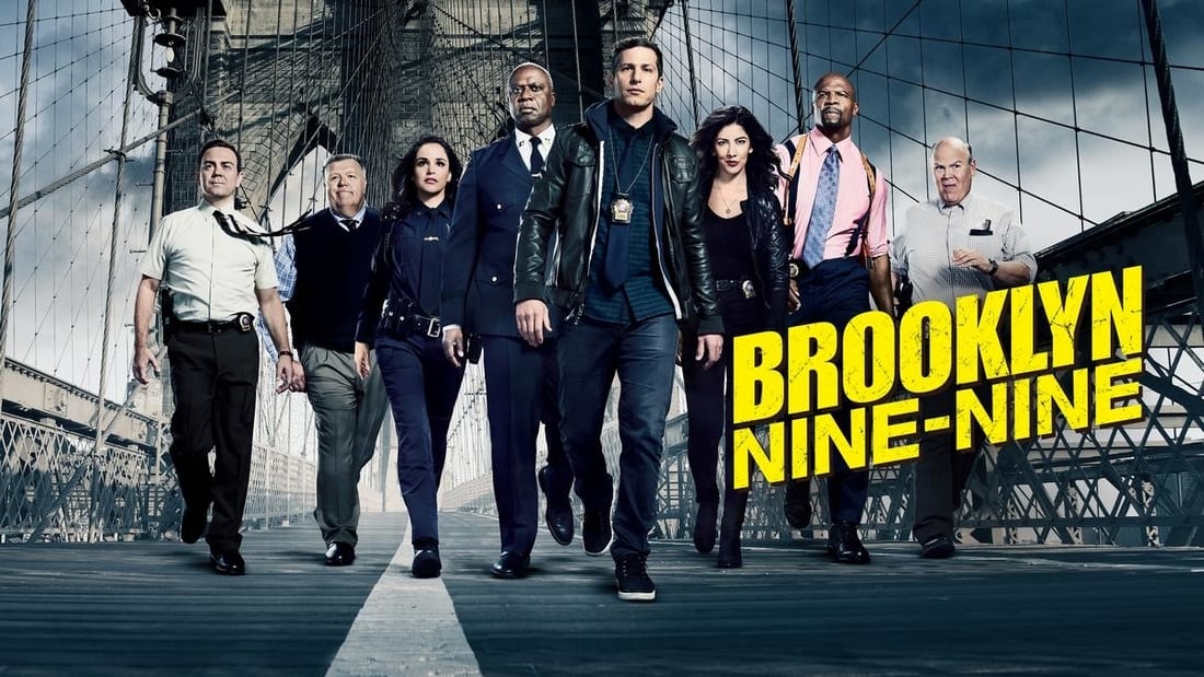 Title art for the NBC sitcom Brooklyn Nine-Nine, featuring the cast walking along the Brooklyn Bridge.