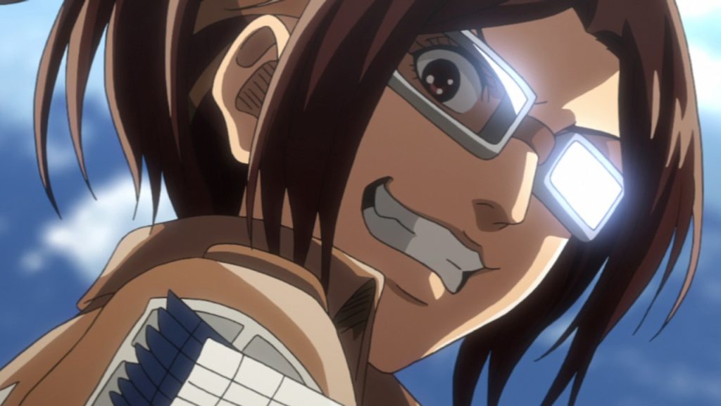 A still image of the character Hange Zoe on the anime show, Attack of Titan.