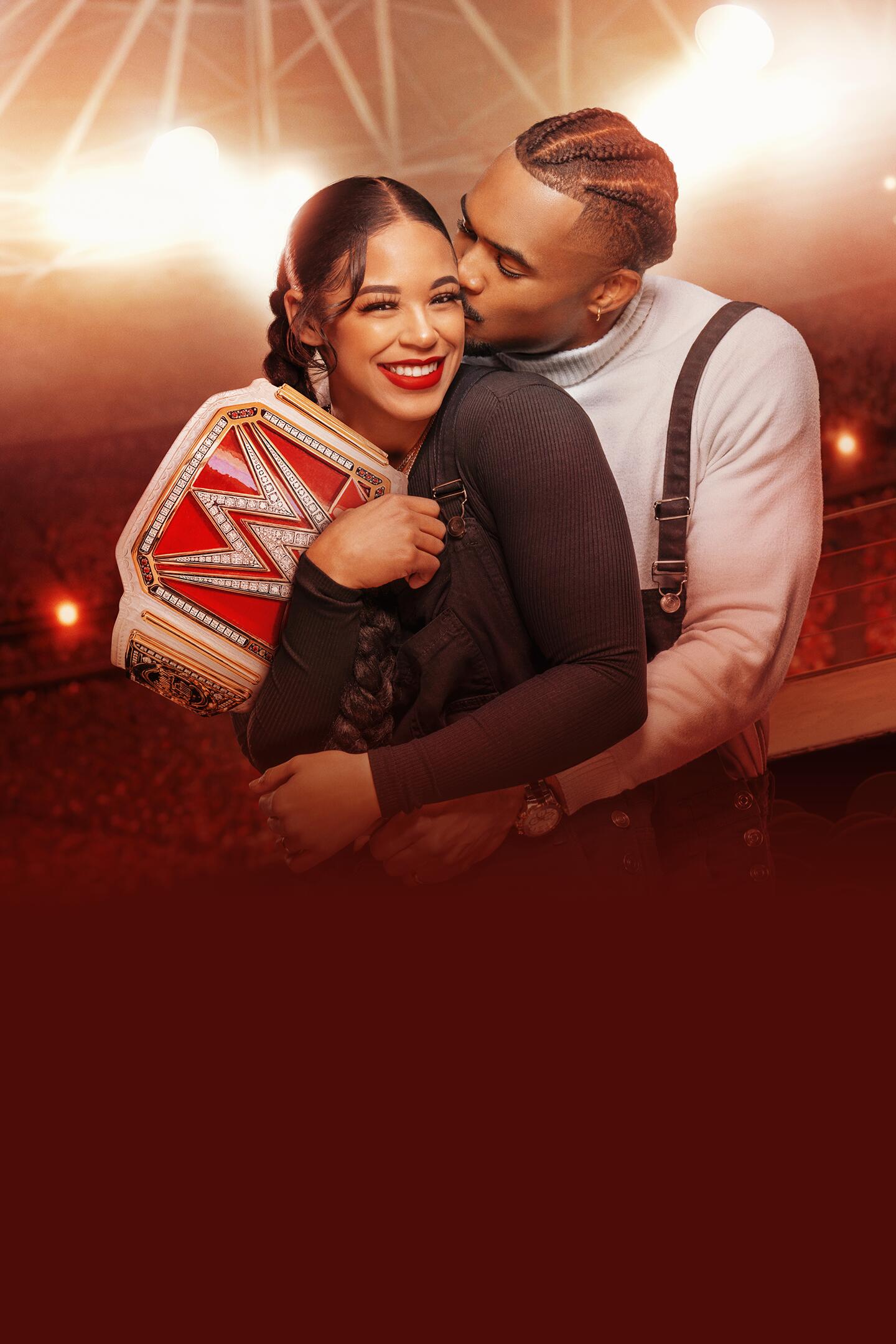 Love & WWE: Bianca & Montez -- Season 1 -- “Love & WWE: Bianca & Montez” is a fun, exciting peek into the personal lives of WWE’s hottest couple. Bianca Belair and Montez Ford’s road to WrestleMania is a wild ride, as Montez continues his ascent and Bianca fights to hold on to her title. With the support of their tight knit group of friends, family and fellow superstars, the dynamic duo somehow always manages to pull off the impossible.  Bianca Belair and Montez Ford, shown. (Courtesy of Hulu)
