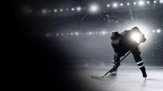 A hockey player on ice in a promotional image for the NHL on Hulu.