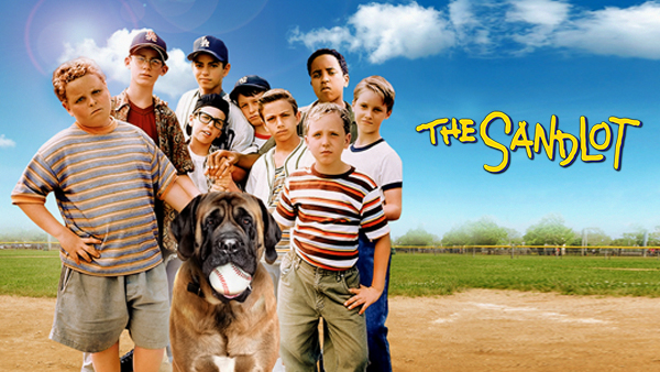 Kids from The Sandlot standing on the baseball field with the dog