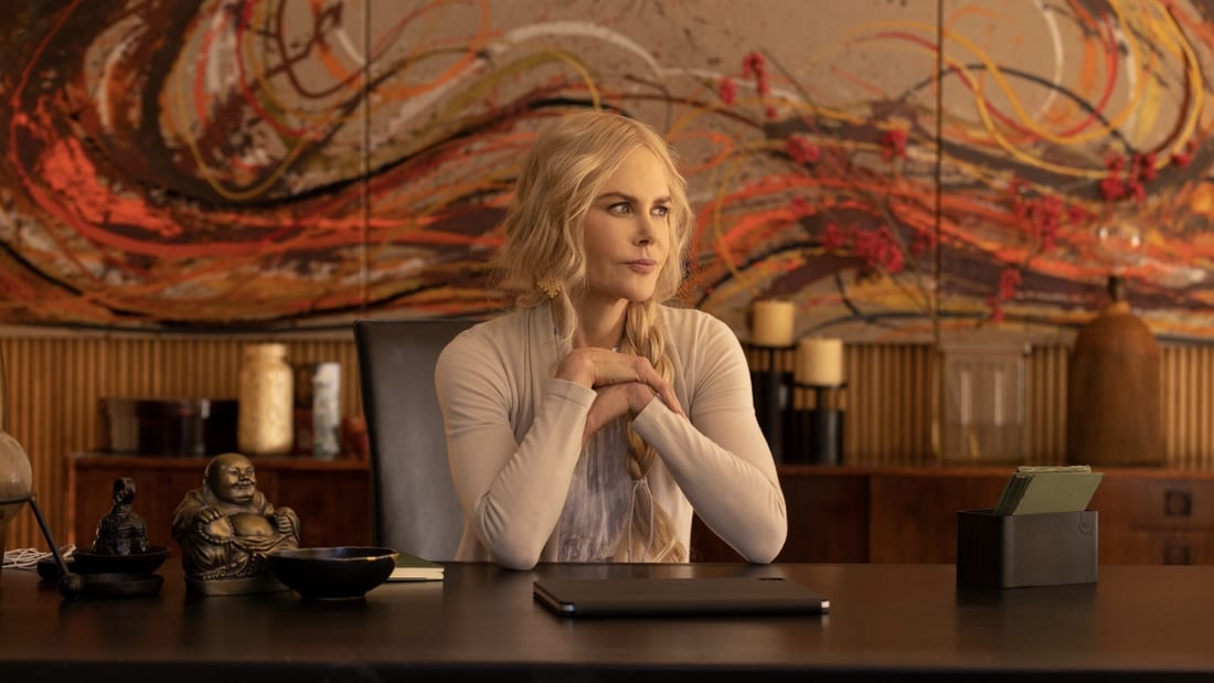 Masha (Nicole Kidman) sitting at a desk in the series Nine Perfect Strangers.