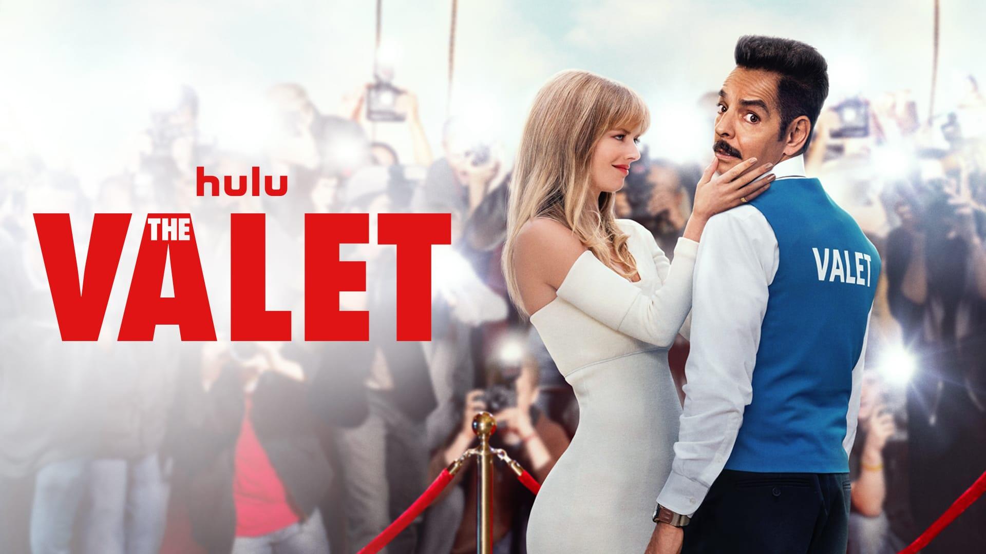 The Valet -- In “The Valet,” world famous movie star, Olivia (Samara Weaving) faces a PR disaster when a paparazzi snaps a photo of her with her married lover, Vincent (Max Greenfield). The hard-working valet Antonio (Eugenio Derbez) accidentally appears in the same photo and is enlisted to pose as Olivia’s new boyfriend as a cover up. This ruse with Olivia thrusts Antonio into the spotlight and unexpected chaos. In this fish out of water romantic comedy, two worlds and cultures collide as both Olivia and Antonio start to see themselves more clearly than ever before. “The Valet,” directed by Richard Wong and written by Rob Greenberg and Bob Fisher, is the English-language remake of the hit French film. Antonio (Eugenio Derbez) and Olivia (Samara Weaving), shown. (Courtesy of Hulu)