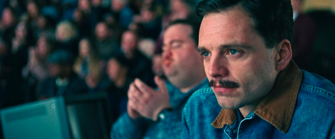 Still image from I, Tonya featuring Sebastian Stan watching the competition